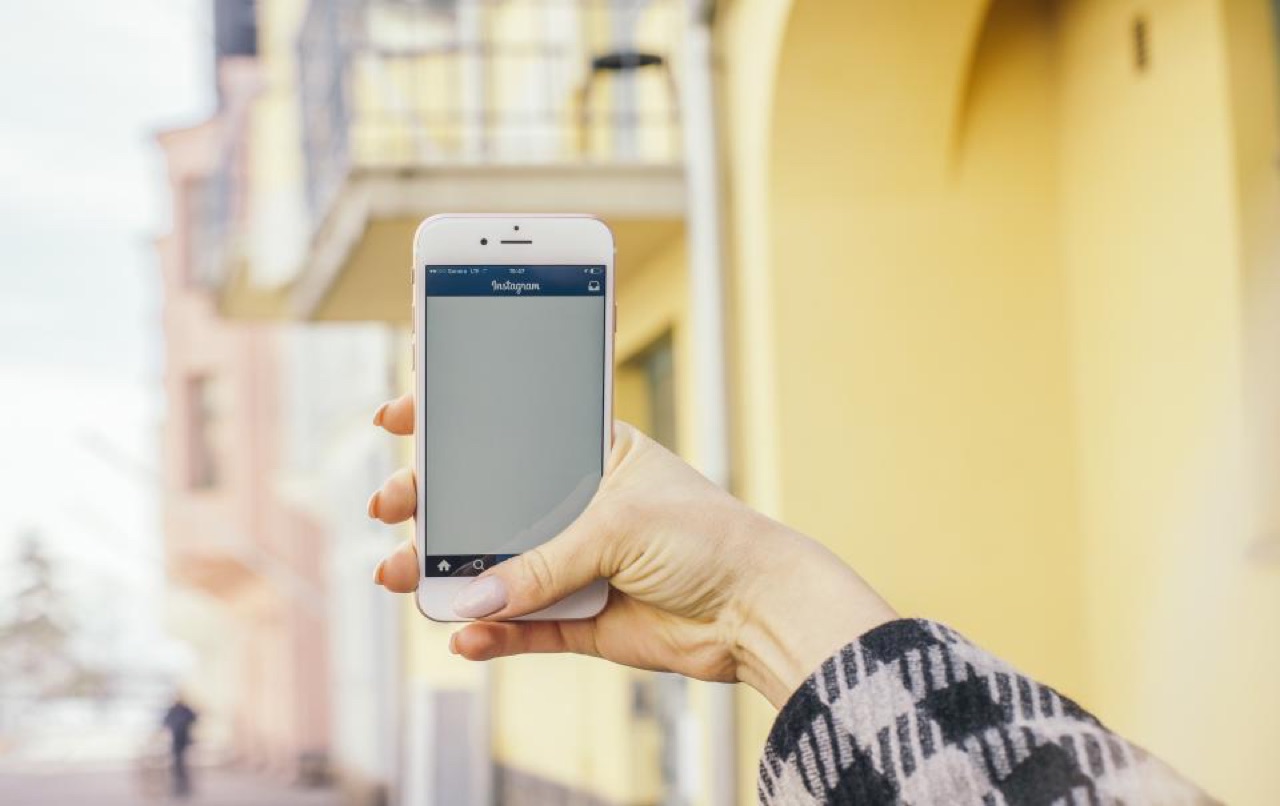 A phone showing an Instagram Reel with the view counter stuck at a low number