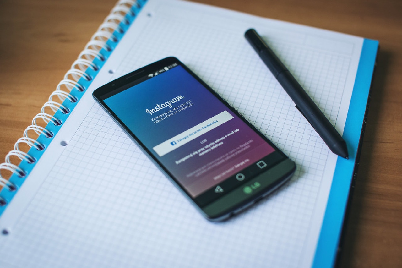 A new Instagram profile on a phone screen showing a flat reach graph stuck near zero